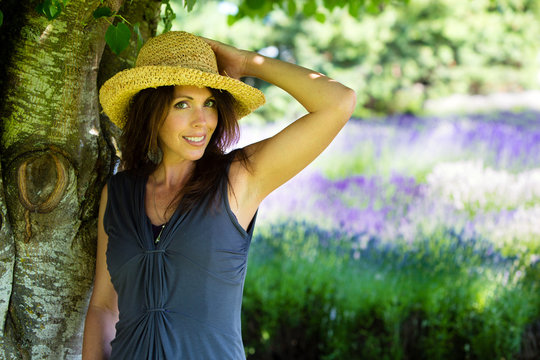 Beautiful Woman Under The Shade Of A Tree