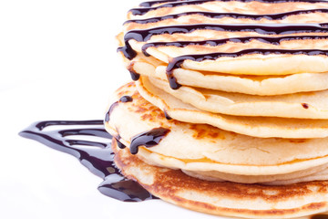 stack of pancakes with chocolate sauce
