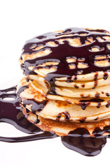 stack of pancakes with chocolate sauce