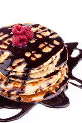 stack of pancakes with chocolate sauce