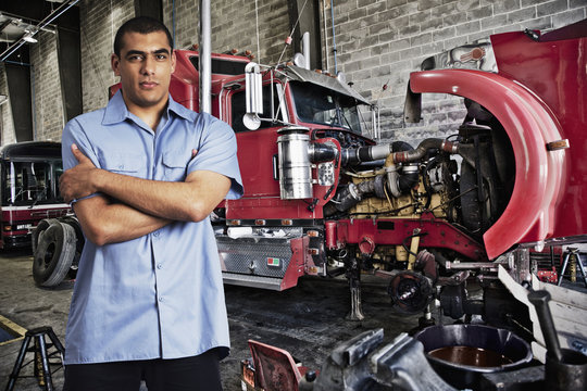 Mechanic standing in auto repair shop