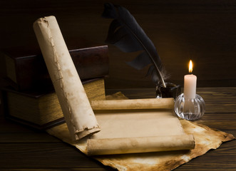 old papers and books on a wooden table