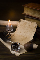 old papers and books on a wooden table