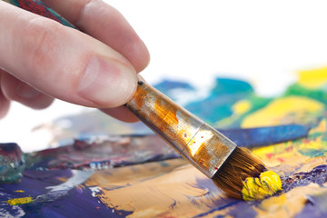 Somebody is painting some picture with paintbrush, isolated