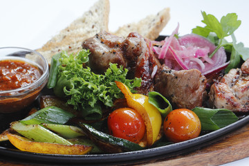 Grilled meat with vegetables and sauce