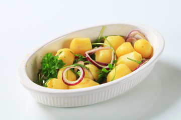 Potatoes with onion and arugula