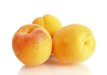 Naklejka na ściany i meble ripe sweet apricots isolated on white