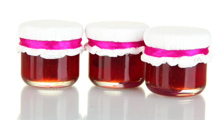Jars with tasty jam isolated on white