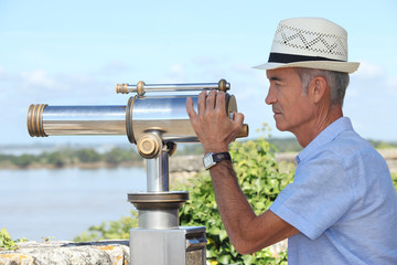 Man using a telescope