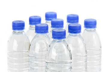 Rows of water bottles isolated on white background