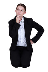 businesswoman thinking and holding her chin