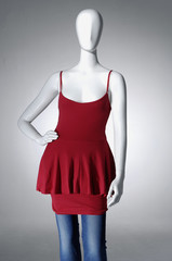 Mannequin dressed in red shirt and trousers