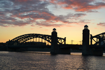 Neva river and Bridge Peter the Great at sunset