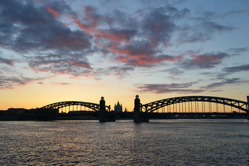 Neva river and Bridge Peter the Great at sunset