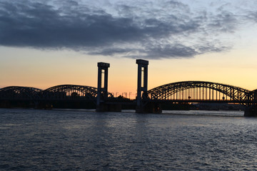 Neva river and Finnish railway bridge at sunset