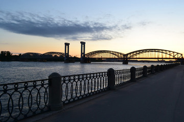 Neva river and Finnish railway bridge at sunset