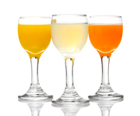 Tropical juices in glasses isolated on white