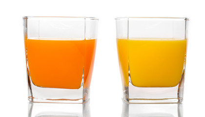 Tropical juices in glasses isolated on white