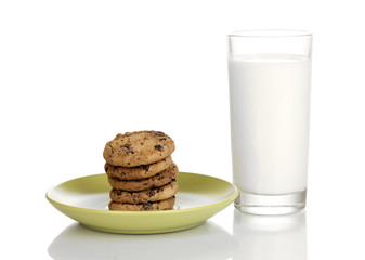 Glass of milk and cookies isolated on white