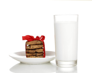 Glass of milk and cookies isolated on white