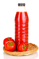 Tomato juice in bottle on wicker mat isolated on white