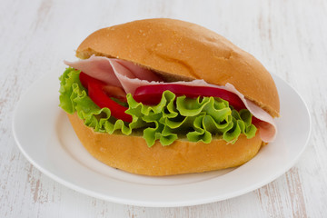 sandwich with ham, pepper and lettuce