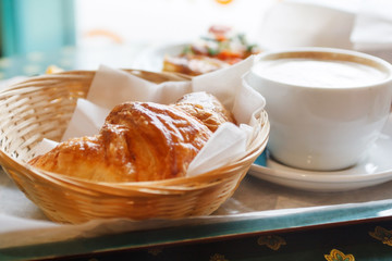 Croissant and a cup of coffee