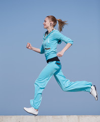 Fototapeta premium Sportswoman running outdoors
