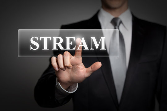 businessman pressing virtual button - stream