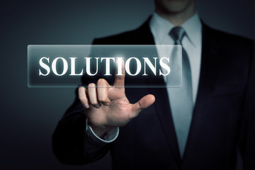 businessman pressing virtual button - solutions