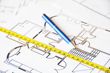 Pen and ruler on a floor plan