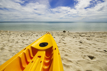 Paddle boats on white sandy beach and blue sea