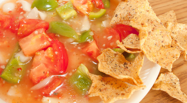Salsa And Tortilla Chips On A White Plate