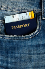 pasport with boarding pass in jeans