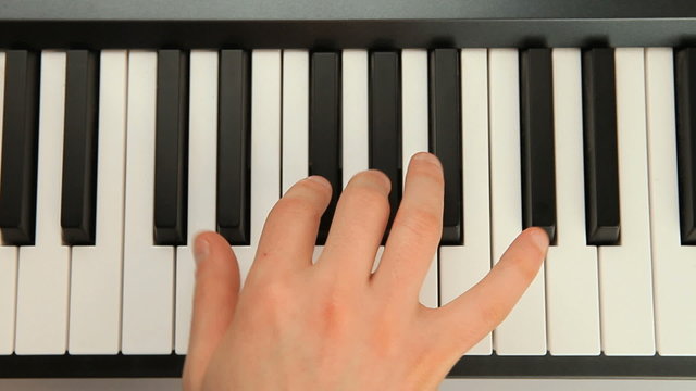 Hand playing piano