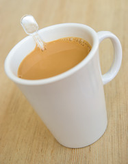 cup of milk tea on a wooden table