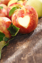 Delicious red apple with heart cutout © exclusive-design