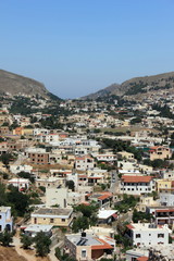 houses on hill at the greek island town of kalymnos