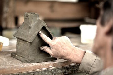 Person working with clay