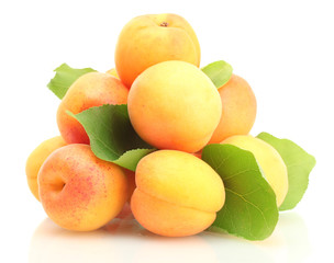 Naklejka na ściany i meble ripe apricots with green leaves isolated on white