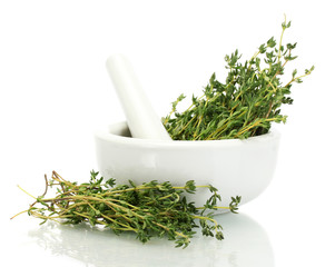 mortar with fresh green thyme isolated on white