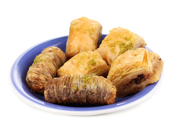Sweet baklava on plate isolated on white