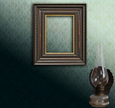 Vintage mockup, art deco empty frame on green damask and oil lamp