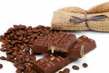 Chocolate and coffee beans isolated on white background.