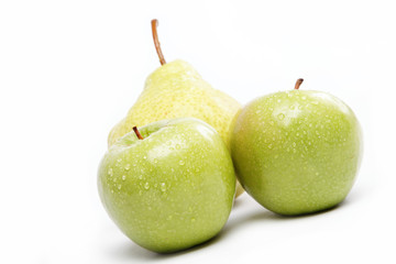 Fresh fruit. Apples and pears on a plate isolated over white bac