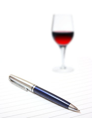 Ballpoint with wine glass on lined paper
