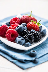 Various berry fruits on a plate