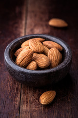 Almonds in a small stone bowl