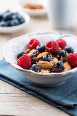 Muesli with fresh fruits, almonds and raisins
