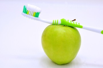 Green apple and toothbrush